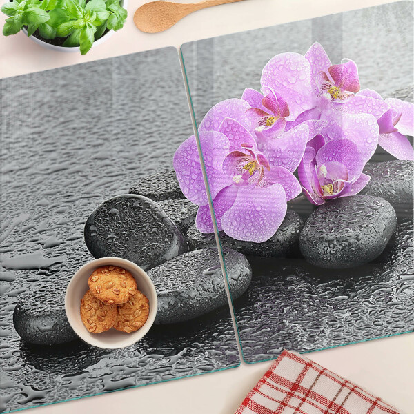 Planche à découper verre Fleurs et pierres sur fond d'eau