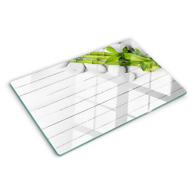 Planche à découper en verre Bambou et pierres sur fond de bois