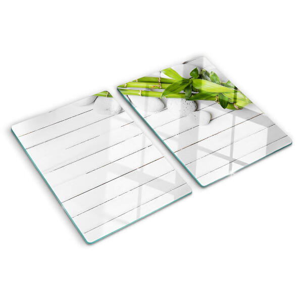 Planche à découper en verre Bambou et pierres sur fond de bois