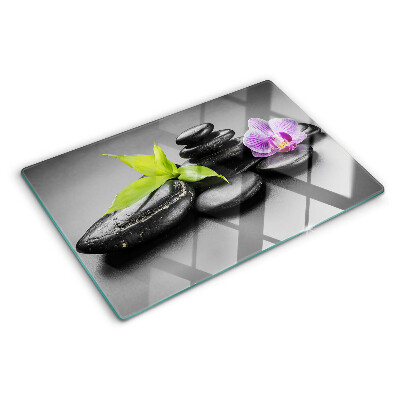 Planche à découper en verre Pierres et orchidées en arrière-plan