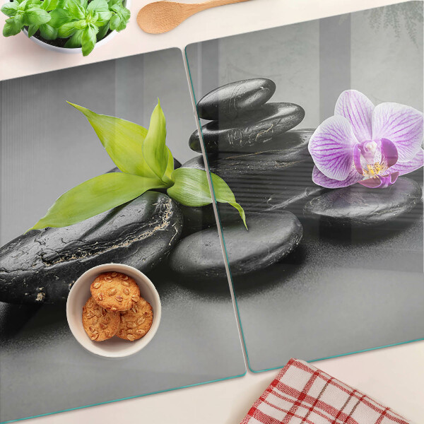 Planche à découper en verre Pierres et orchidées en arrière-plan