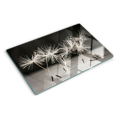 Planche à découper verre Pissenlits duveteux sur un fond monochrome