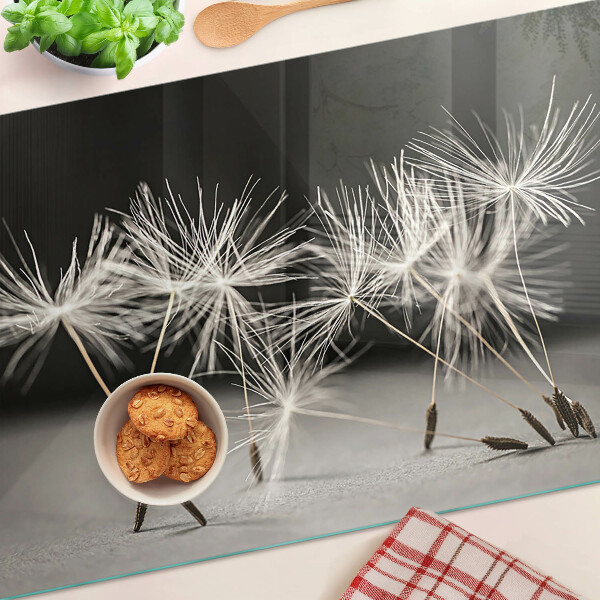 Planche à découper verre Pissenlits duveteux sur un fond monochrome