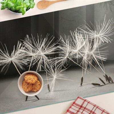 Planche à découper verre Pissenlits duveteux sur un fond monochrome