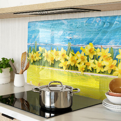 Planche à découper en verre Fleurs de jonquilles contre le ciel