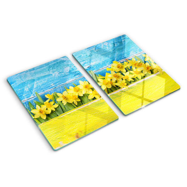 Planche à découper en verre Fleurs de jonquilles contre le ciel