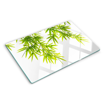 Planche à découper verre Feuilles de bambou sur fond de fenêtre
