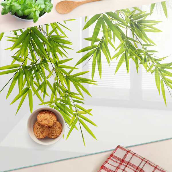 Planche à découper verre Feuilles de bambou sur fond de fenêtre
