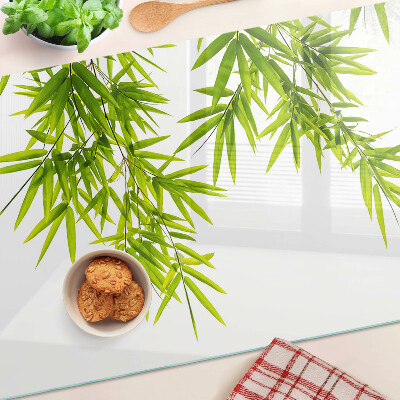 Planche à découper verre Feuilles de bambou sur fond de fenêtre