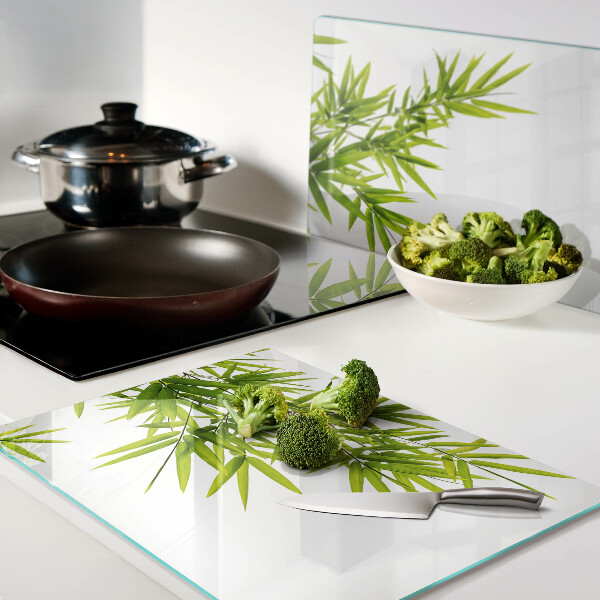 Planche à découper verre Feuilles de bambou sur fond de fenêtre
