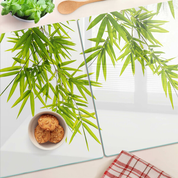 Planche à découper verre Feuilles de bambou sur fond de fenêtre