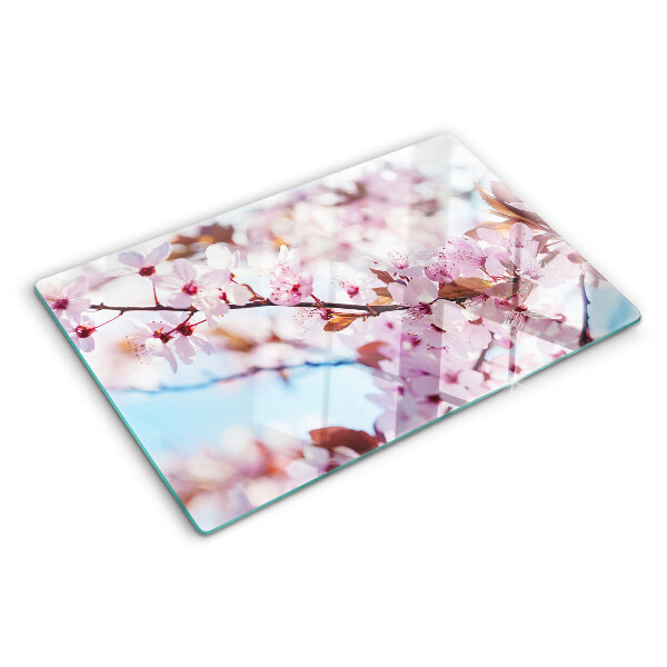 Planche à découper en verre Fleurs de cerisier sur fond bleu