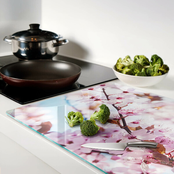 Planche à découper en verre Fleurs de cerisier sur fond bleu
