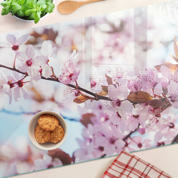 Planche à découper en verre Fleurs de cerisier sur fond bleu