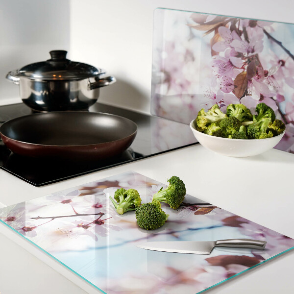 Planche à découper en verre Fleurs de cerisier sur fond bleu
