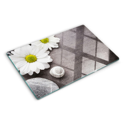 Planche à découper verre Fleurs et pierres en arrière-plan