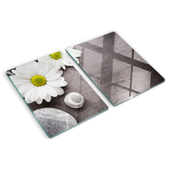 Planche à découper verre Fleurs et pierres en arrière-plan
