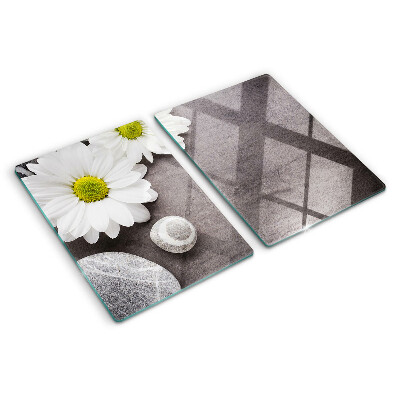 Planche à découper verre Fleurs et pierres en arrière-plan