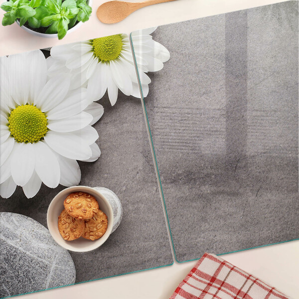 Planche à découper verre Fleurs et pierres en arrière-plan