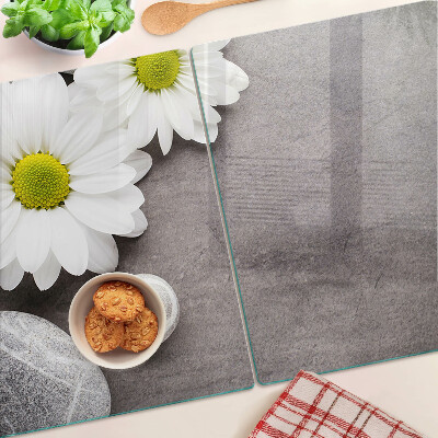 Planche à découper verre Fleurs et pierres en arrière-plan