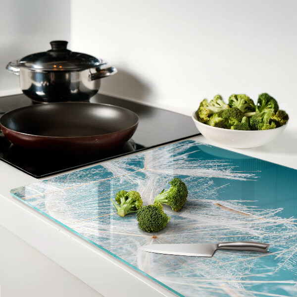 Planche à découper en verre Pissenlits sur fond bleu