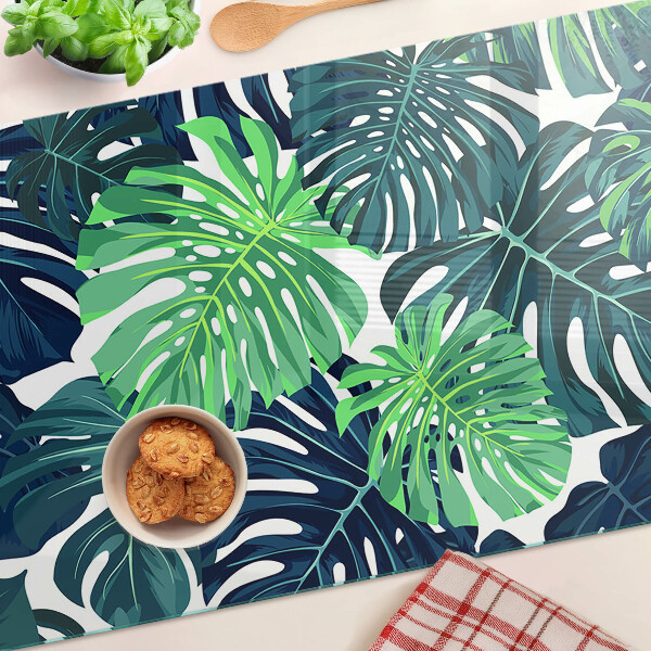 Planche à découper en verre Feuilles de Monstera sur fond tropical