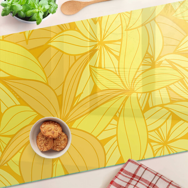 Planche à découper en verre Feuilles jaunes dans un style tropical