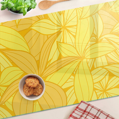 Planche à découper en verre Feuilles jaunes dans un style tropical