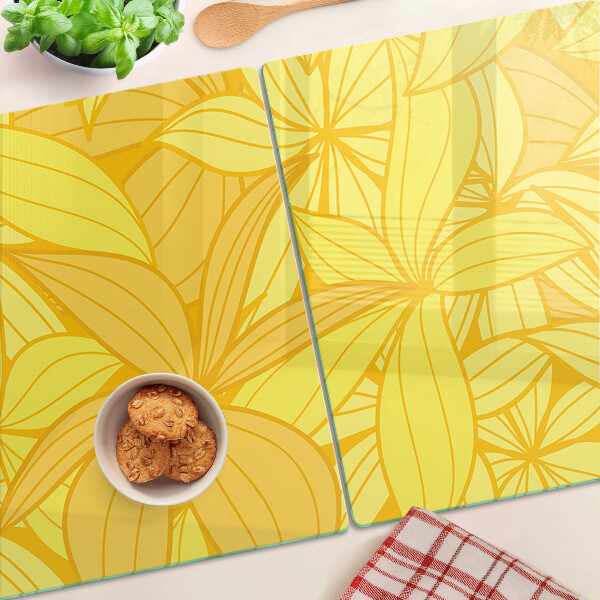 Planche à découper en verre Feuilles jaunes dans un style tropical