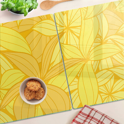 Planche à découper en verre Feuilles jaunes dans un style tropical