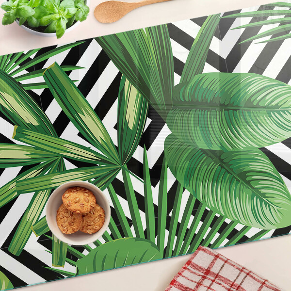 Planche à découper en verre Feuilles tropicales sur rayures