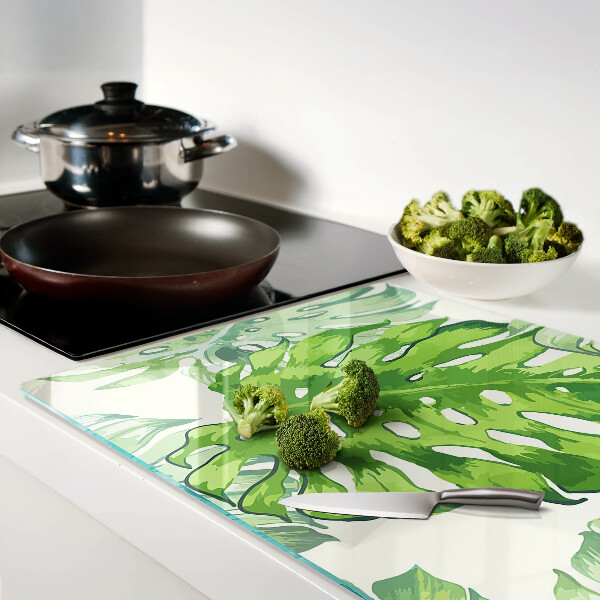 Planche à découper en verre Feuilles de Monstera sur fond clair