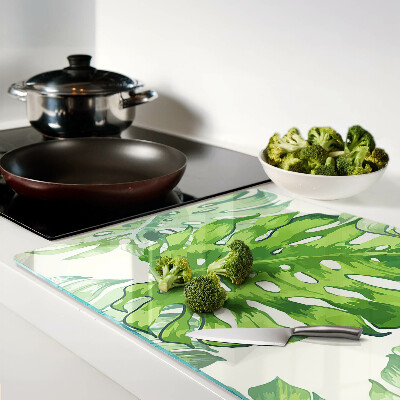 Planche à découper en verre Feuilles de Monstera sur fond clair