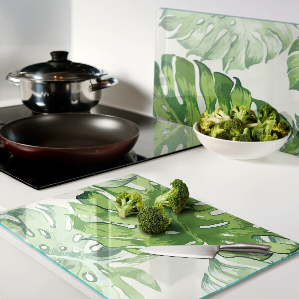 Planche à découper en verre Feuilles de Monstera sur fond clair