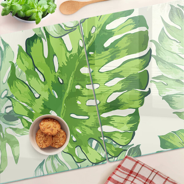 Planche à découper en verre Feuilles de Monstera sur fond clair