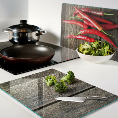 Planche à découper verre Piments sur fond de bois