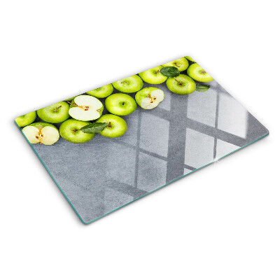 Planche à découper verre Pommes vertes sur une surface grise