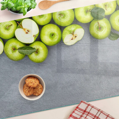 Planche à découper verre Pommes vertes sur une surface grise