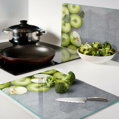 Planche à découper verre Pommes vertes sur une surface grise