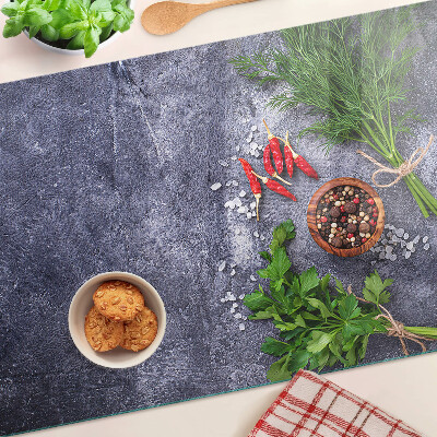 Planche à découper en verre Herbes et épices sur fond de pierre