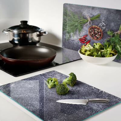 Planche à découper en verre Herbes et épices sur fond de pierre
