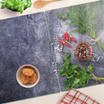 Planche à découper en verre Herbes et épices sur fond de pierre