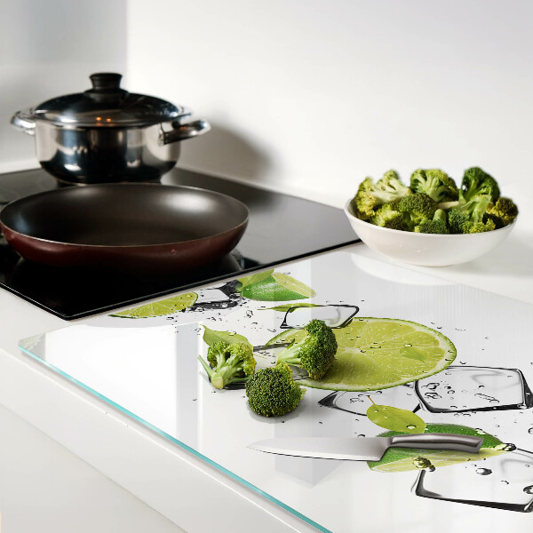 Planche à découper en verre Citrons avec de la glace dans l'eau