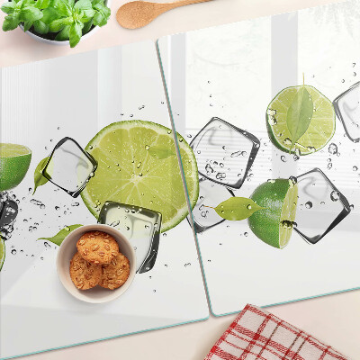 Planche à découper en verre Citrons avec de la glace dans l'eau