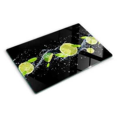Planche à découper en verre Citrons dans l'eau avec des feuilles de menthe