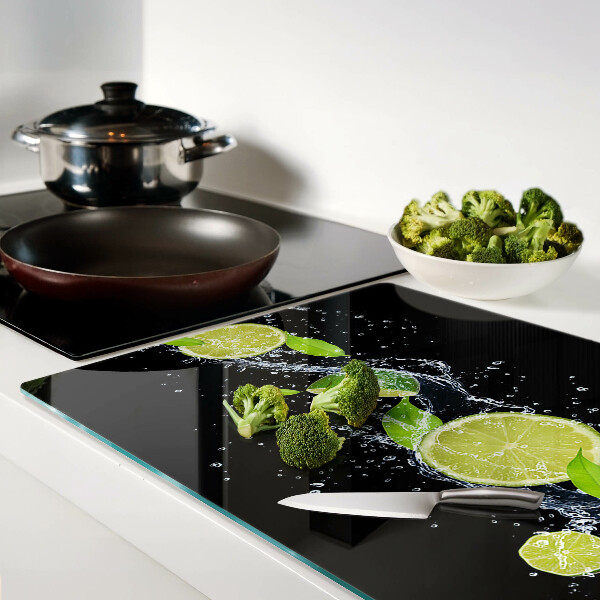 Planche à découper en verre Citrons dans l'eau avec des feuilles de menthe