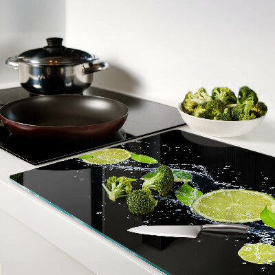 Planche à découper en verre Citrons dans l'eau avec des feuilles de menthe