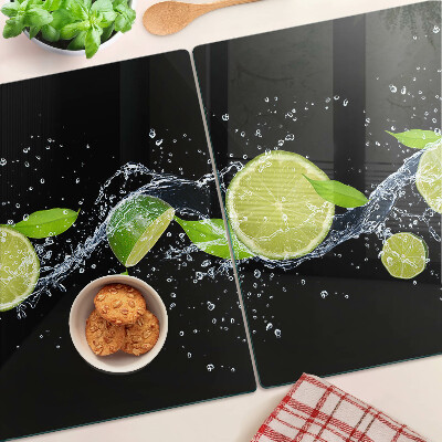 Planche à découper en verre Citrons dans l'eau avec des feuilles de menthe