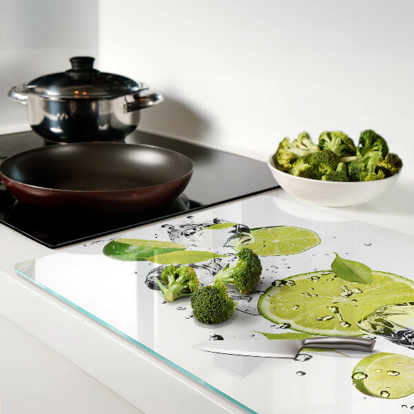 Planche à découper en verre Citrons et glace dans l'eau