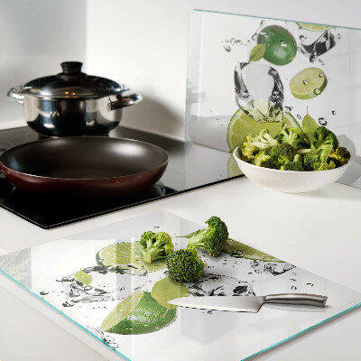 Planche à découper en verre Citrons et glace dans l'eau